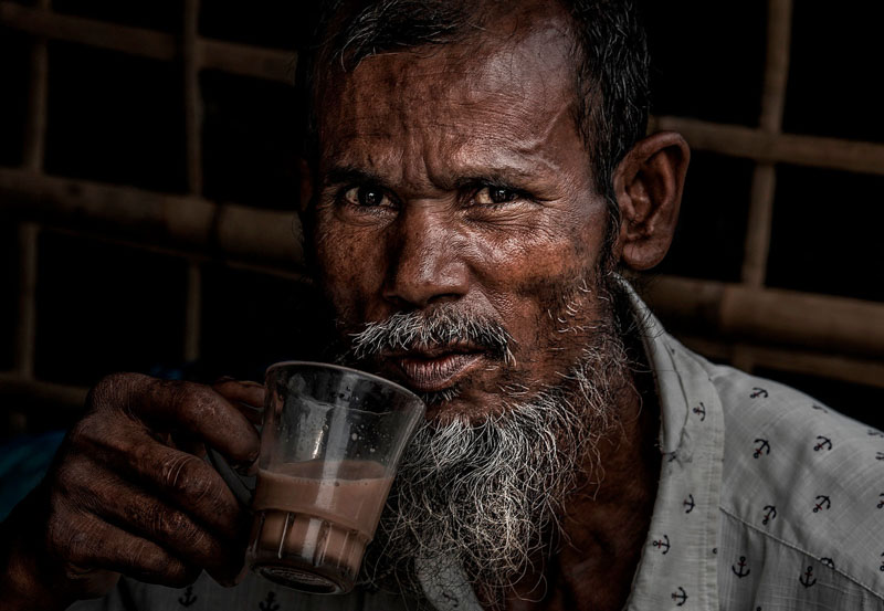 Rohingya refugee having a chai